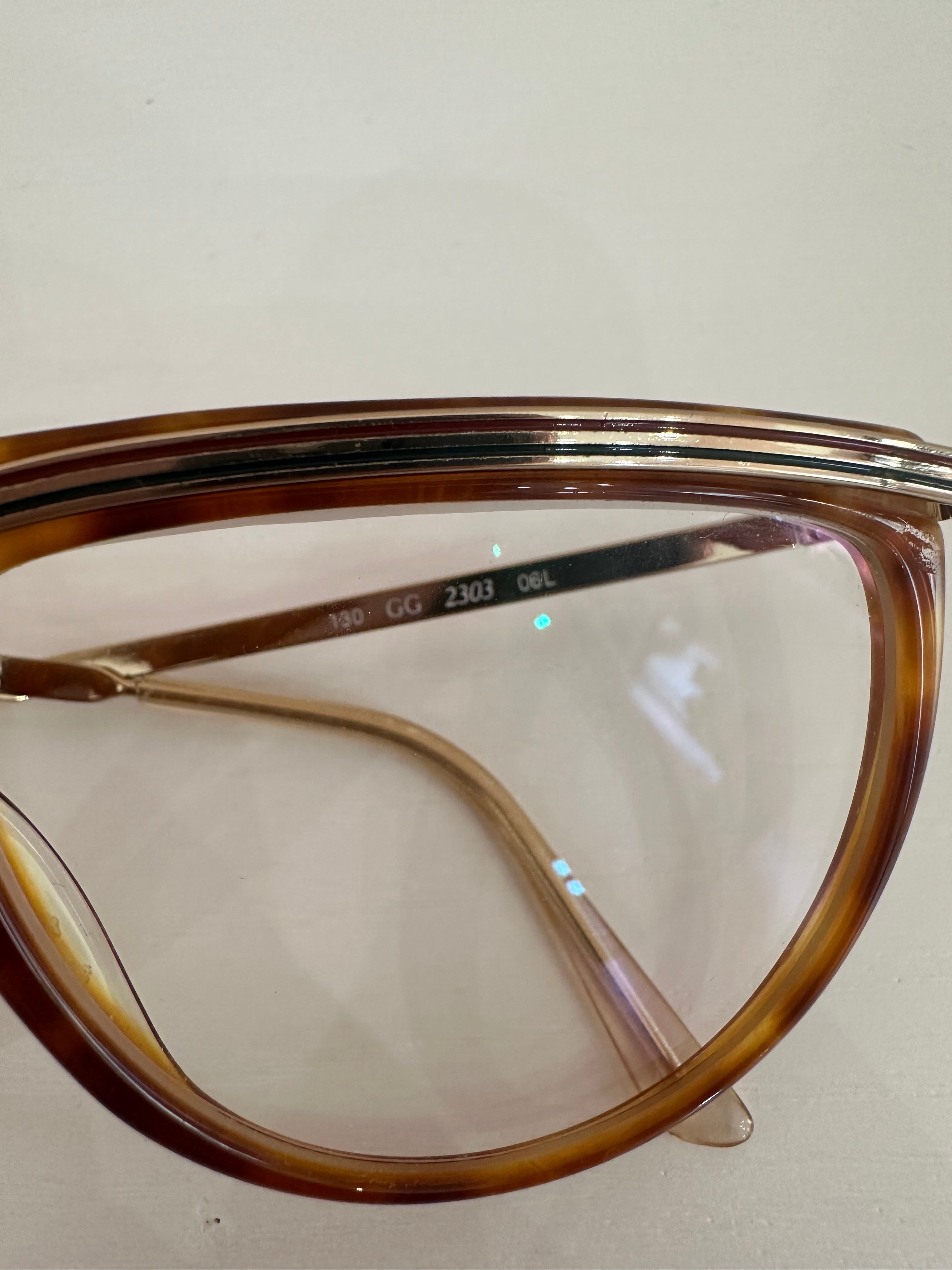 Occhiali Gucci vintage tartarugati, aste oro motivo web