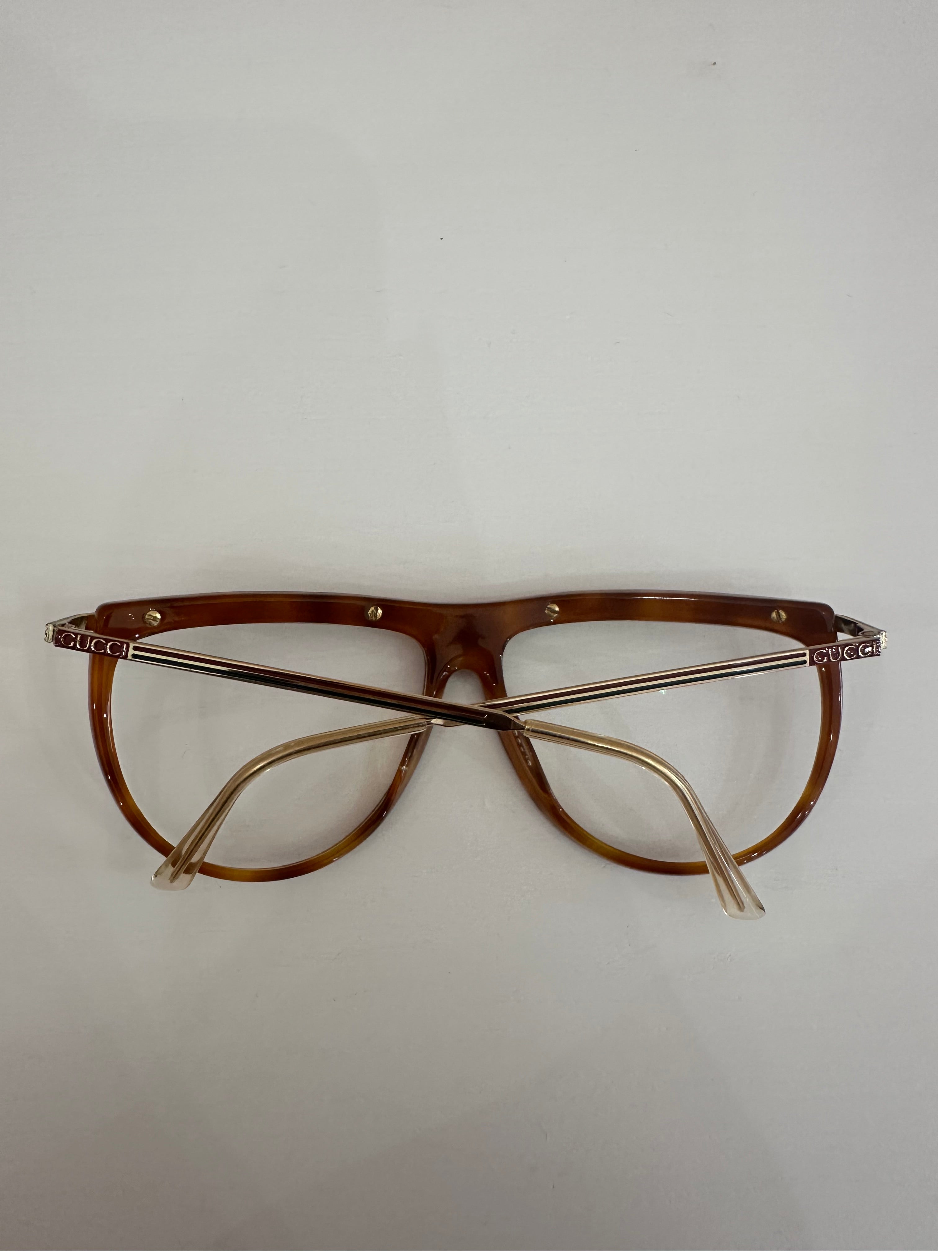 Occhiali Gucci vintage tartarugati, aste oro motivo web